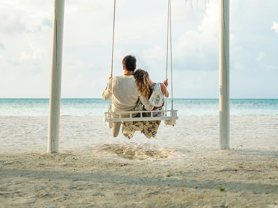 couple-swing A couple on a swing at the beach